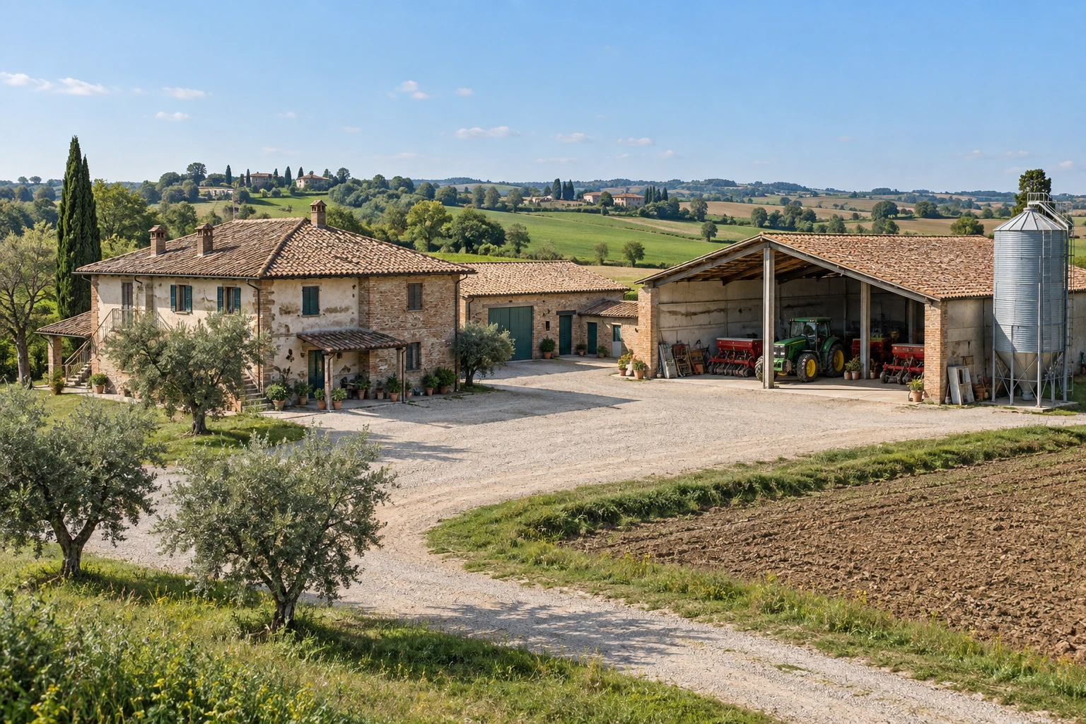 Italian farm with a farmhouse, machinery shed, silo and fields